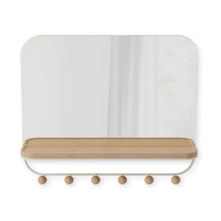 A rectangular mirror with a wooden shelf and hooks