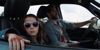Logan stars Hugh Jackman and Dafne Keen in a car