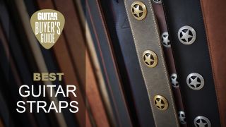 A selection of leather guitar straps with brass and silver stars fitted to them
