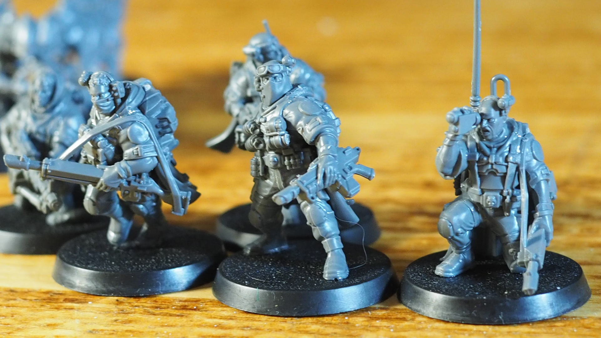 Kill Team: Terror on Devlan Spectre Squad models on a wooden surface