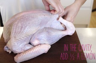 How to cook a turkey illustrated by a person stuffing a turkey