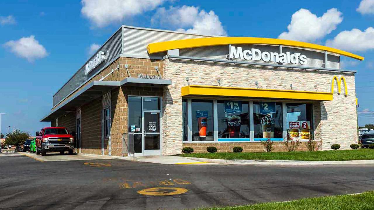 Exterior photo of a McDonald&#039;s restaurant on a sunny day