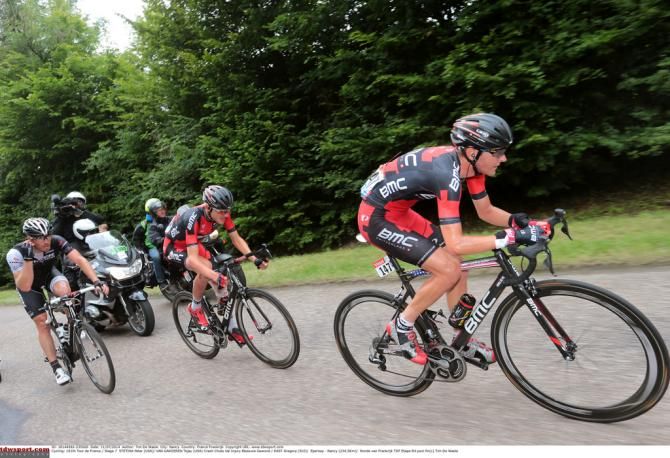Tejay van Garderen (BMC) being paced back to the peloton after crashing