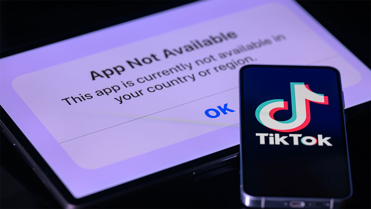 Image of TikTok logo on phone screen and &quot;app not available&quot; message