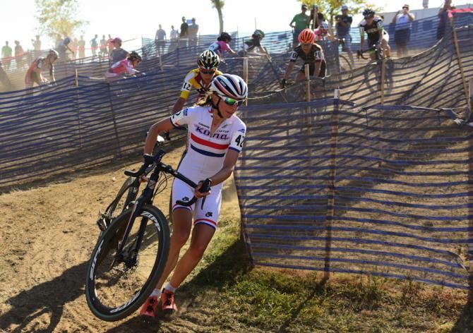 Helen Wyman (Kona) rounding a corner before a long set of stairs on lap two