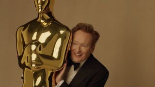 A screen capture of Conan O'Brien comically concealed by an oversized Oscar, preparing for the 2025 Academy Awards, is on the Oscars' official YouTube. 