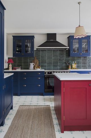 Dark blue kitchen with red island
