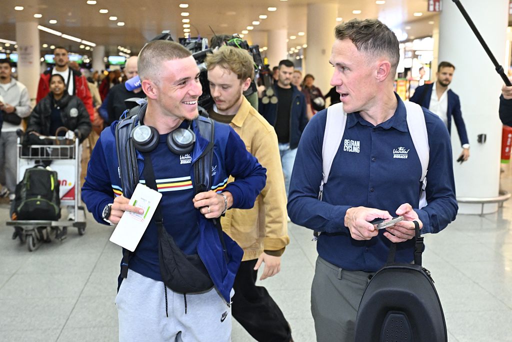 Belgian Remco Evenepoel and Coach of the Belgian national cycling team Serge Pauwels pictured at the departure of the Belgian national cycling team to Rwanda for the road world championships, at Brussels International Airport, in Zaventem, Thursday 18 September 2025. The 2025 UCI Road World Championships take place from 21 to 28 September in Kigali, Rwanda. (Photo by ERIC LALMAND / BELGA MAG / Belga via AFP)