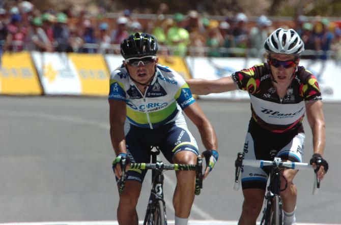 Tom-Jelte Slagter (Blanco) gives stage winner Simon Gerrans (Orica GreenEdge) a congratulatory pat on the back