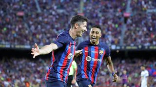 Barcelona pair Robert Lewandowski and Raphinha celebrate a goal scored in the Gamper Trophy win over Pumas at Camp Nou.
