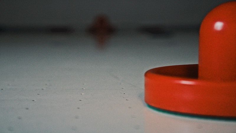 air hockey puck on table