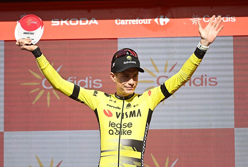 Team Visma-Lease a bike's Danish rider Jonas Vingegaard celebrates on stage after winning the 9th stage of the Vuelta a Espana, a 195 km race between Alfaro and Valdezcaray, on August 31, 2025. (Photo by ANDER GILLENEA / AFP)