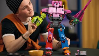 A person playing with a Lego Mecha Team leader