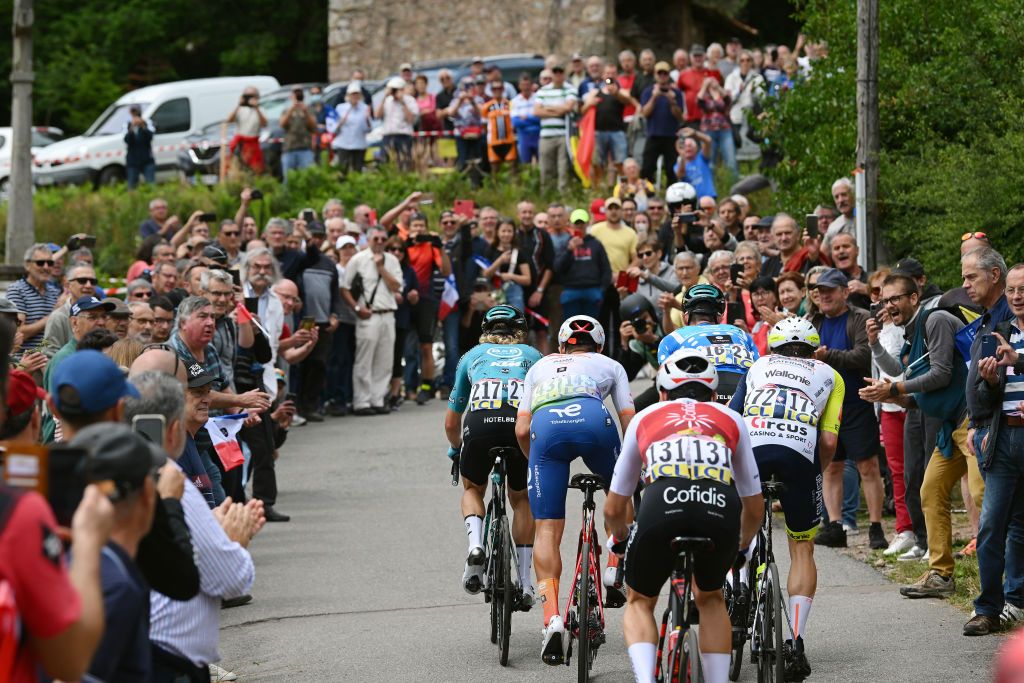 CHAINTRE FRANCE JUNE 09 A general view of Pierre Rolland of France and Team BB Hotels PB KTM Polka Dot Mountain Jersey Benjamin Thomas of France and Team Cofidis Fabien Doubey of France and Team Total Energies Jan Bakelants of Belgium and Team Intermarch Wanty Gobert Matriaux and Sebastian Schnberger of Austria and Team BB Hotels PB KTM competing in the breakaway to climb the Cte de Dun 682m while fans cheer during the 74th Criterium du Dauphine 2022 Stage 5 a 1623km stage from ThizylesBourgs to Chaintr WorldTour Dauphin on June 09 2022 in Chaintre France Photo by Dario BelingheriGetty Images