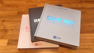 Bitmap Books interview; three retro game art books on a wooden table