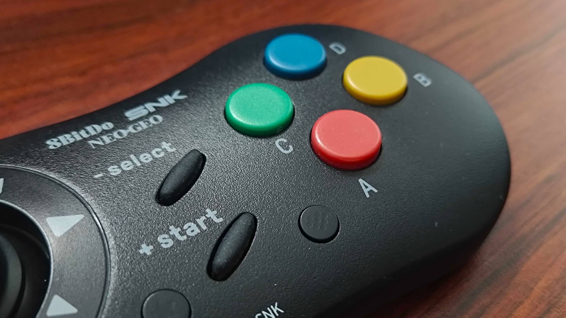 Close up of 8bitdo Neo Geo controller buttons.