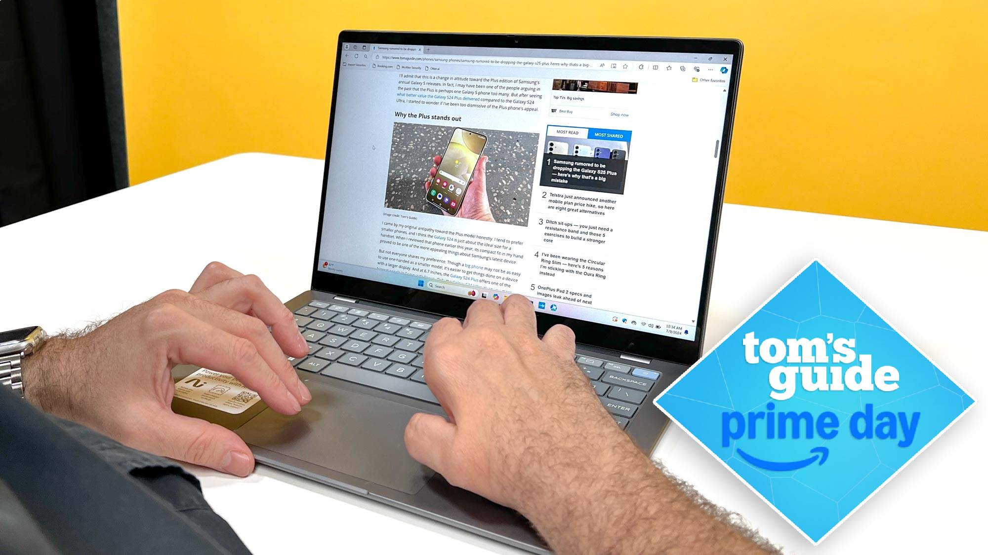 HP Omnibook on table with person typing on it with Tom's Guide Orime Day badge