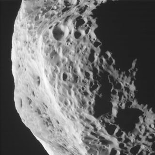 This side view taken by NASA's Cassini spacecraft of Saturn's moon Hyperion reveals craters and other battered surface features. This photo was taken during Cassini's Aug. 25, 2011 flyby of Hyperion.
