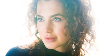 Close-up studio portrait of model against a white background by James Paterson