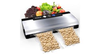 Large vacuum food sealer in a rectangular shape in stainless steel design.