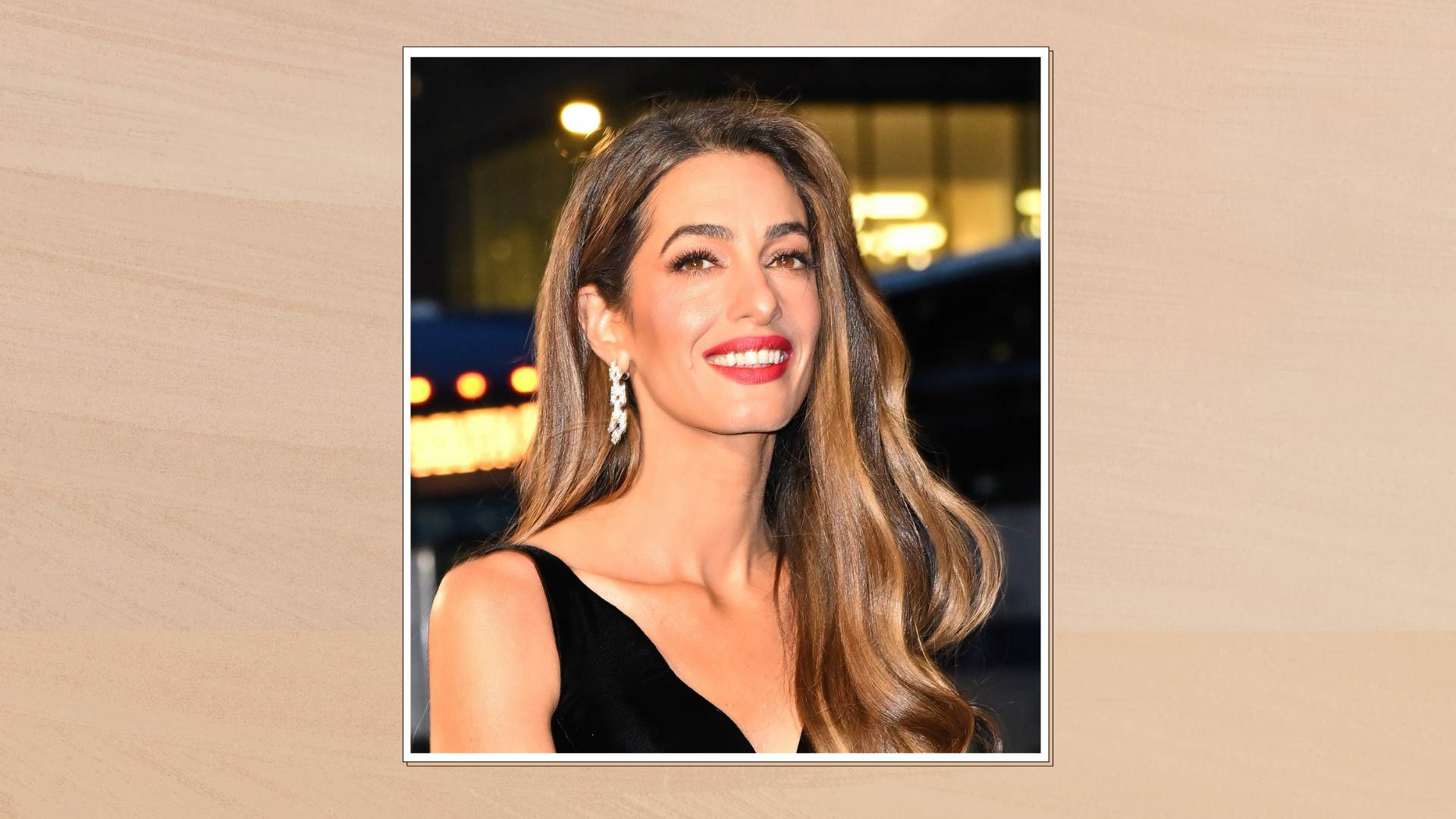 Image of Amal Clooney attending the Clooney Foundation For Justice&#039;s 2024 Albie Awards at New York Public Library on September 26, 2024 in New York City, in a white frame set against a warm beige background