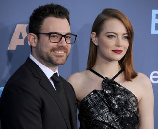 Actress Emma Stone (R) and brother Spencer Stone arrive at The 22nd Annual Critics' Choice Awards at Barker Hangar on December 11, 2016 in Santa Monica, California