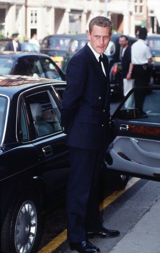 Princess Diana's chauffeur, Stephen Davies, standing next to her car in the 1990s