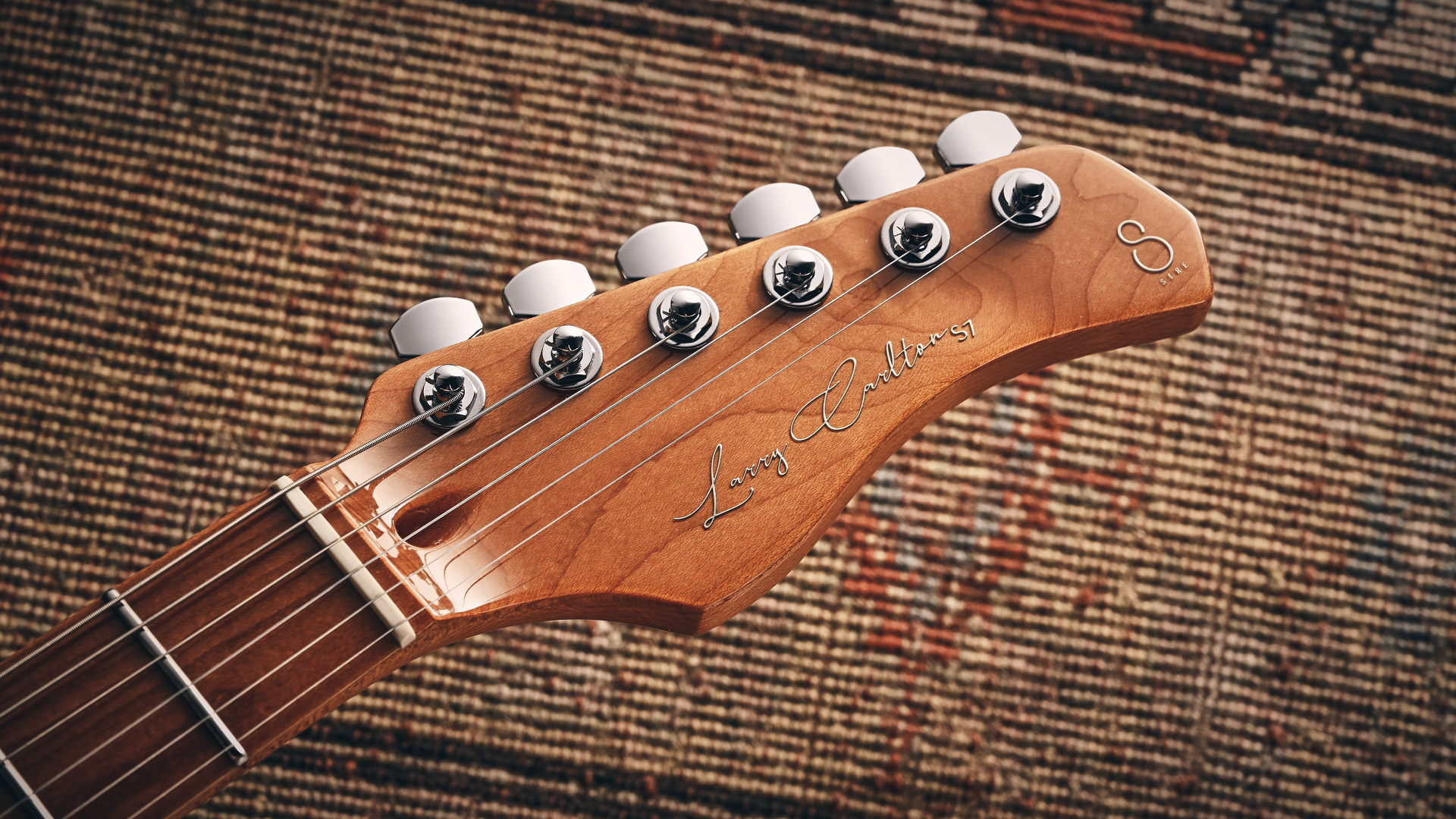 The headstock of the Sire Larry Carlton S7 Ash Top