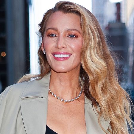 Blake Lively attended a Fendi event in black straight-leg jeans, a trench coat, and a bedazzled Baguette bag