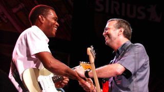 Robert Cray and Eric Clapton onstage at the Crossroads Festival in 2004