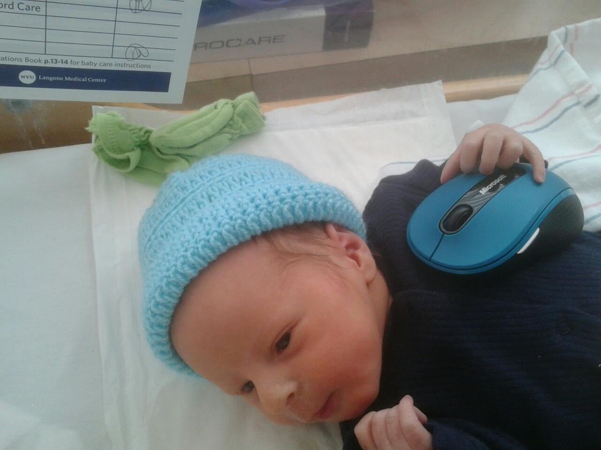 Isaac Checking Out a Mouse at One Day Old
