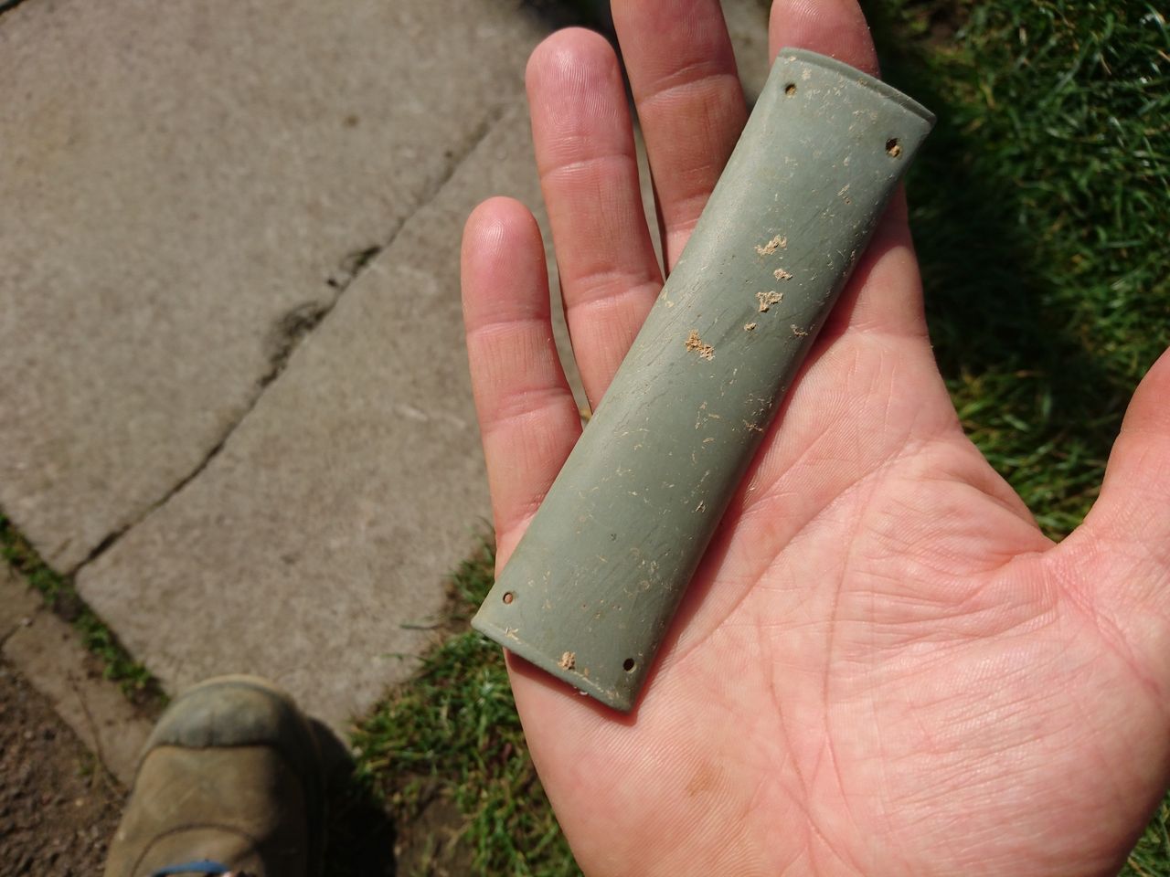 The stone wrist guard found in the chieftain's burial.