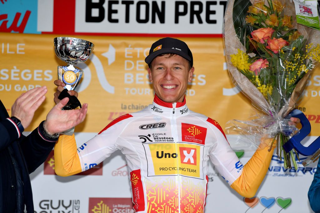 ALES FRANCE FEBRUARY 06 Tobias Halland Johannessen of Norway and UNO X Pro Cycling Team celebrates winning the white best young jersey on the podium ceremony after the 52nd toile De Bessges Tour Du Gard 2022 Stage 5 a 11km individual time trial from Als to Als lErmitage ITT EDB2022 on February 06 2022 in Als France Photo by Luc ClaessenGetty Images