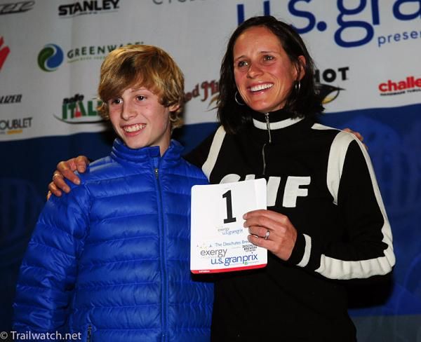 Katerina Nash (Luna Pro Team) smiles as a crowd of people sing happy birthday to her at the number presentation ceremony