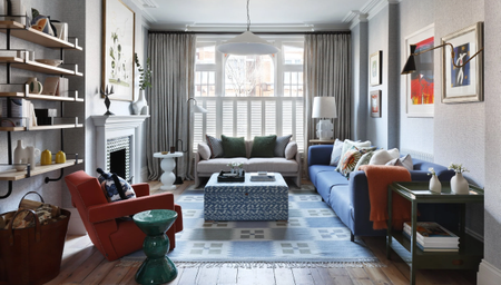 colorful living room with half-height plantation shutters and pale curtains