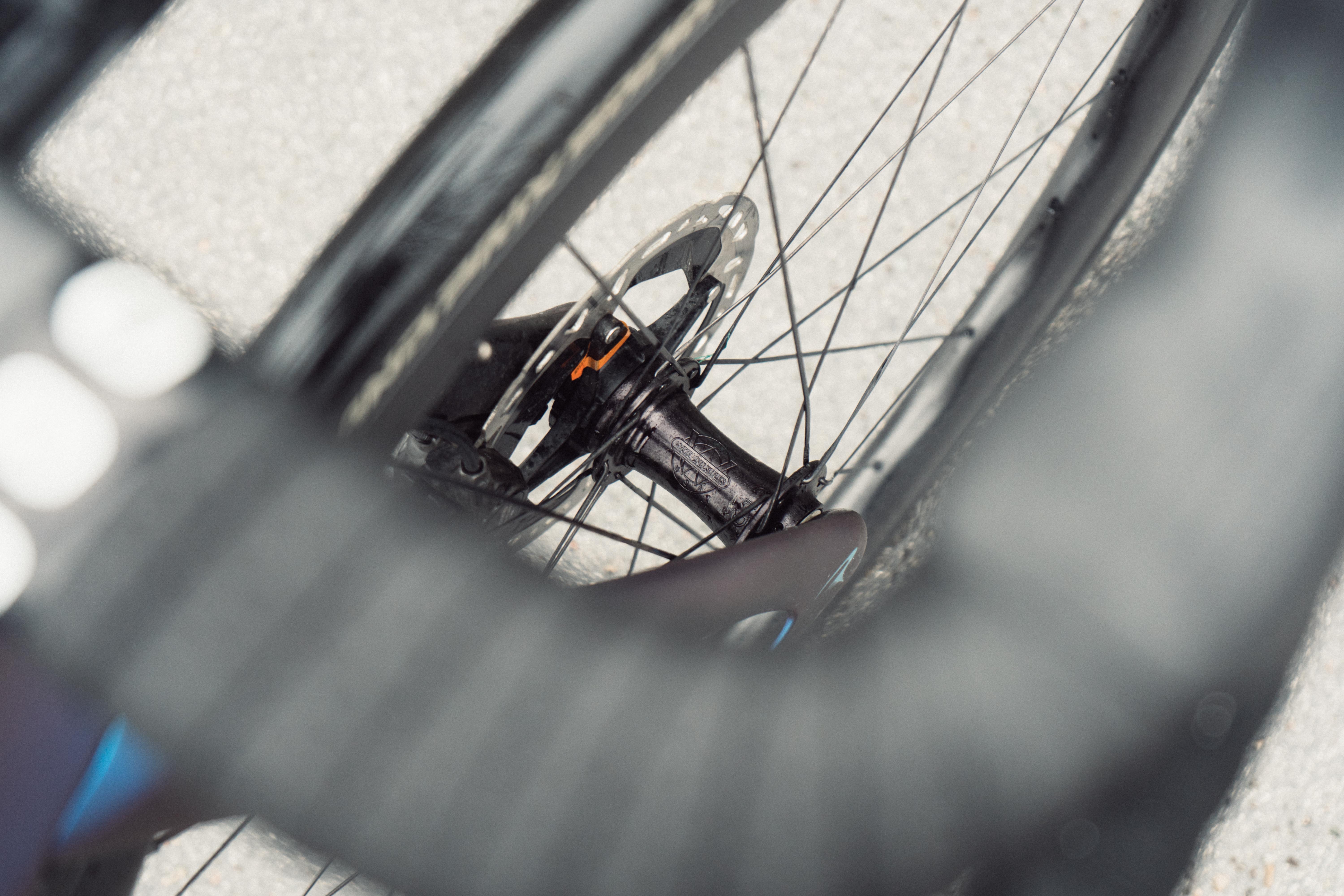 A close up of a black bike wheel hub