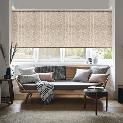 living room with white windows and sofaset with cushions