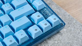 A glacier blue Corsair K65 Plus wireless mechanical keyboard for Mac