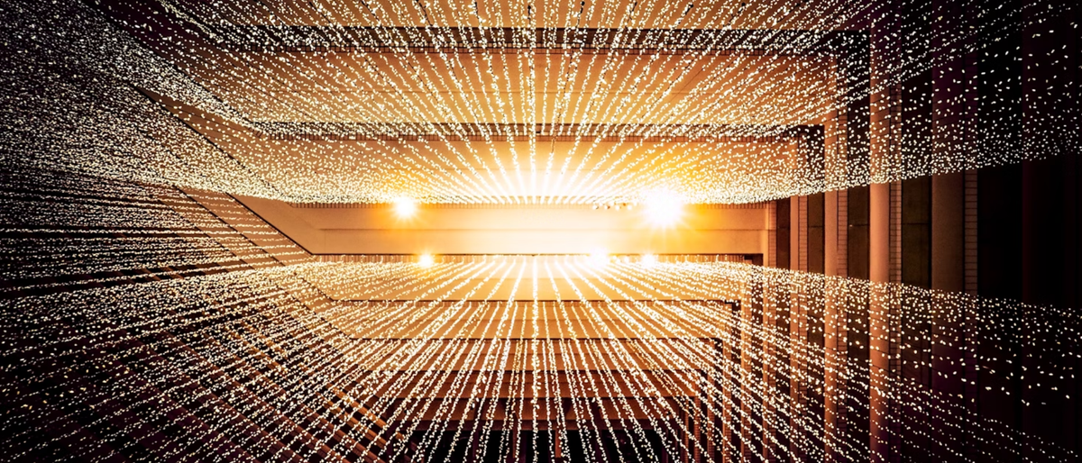 Photograph of a ceiling with lights taken from the ground