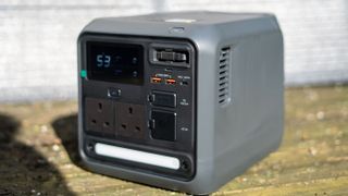 DJI Power 1000 Mini with solar panel behind