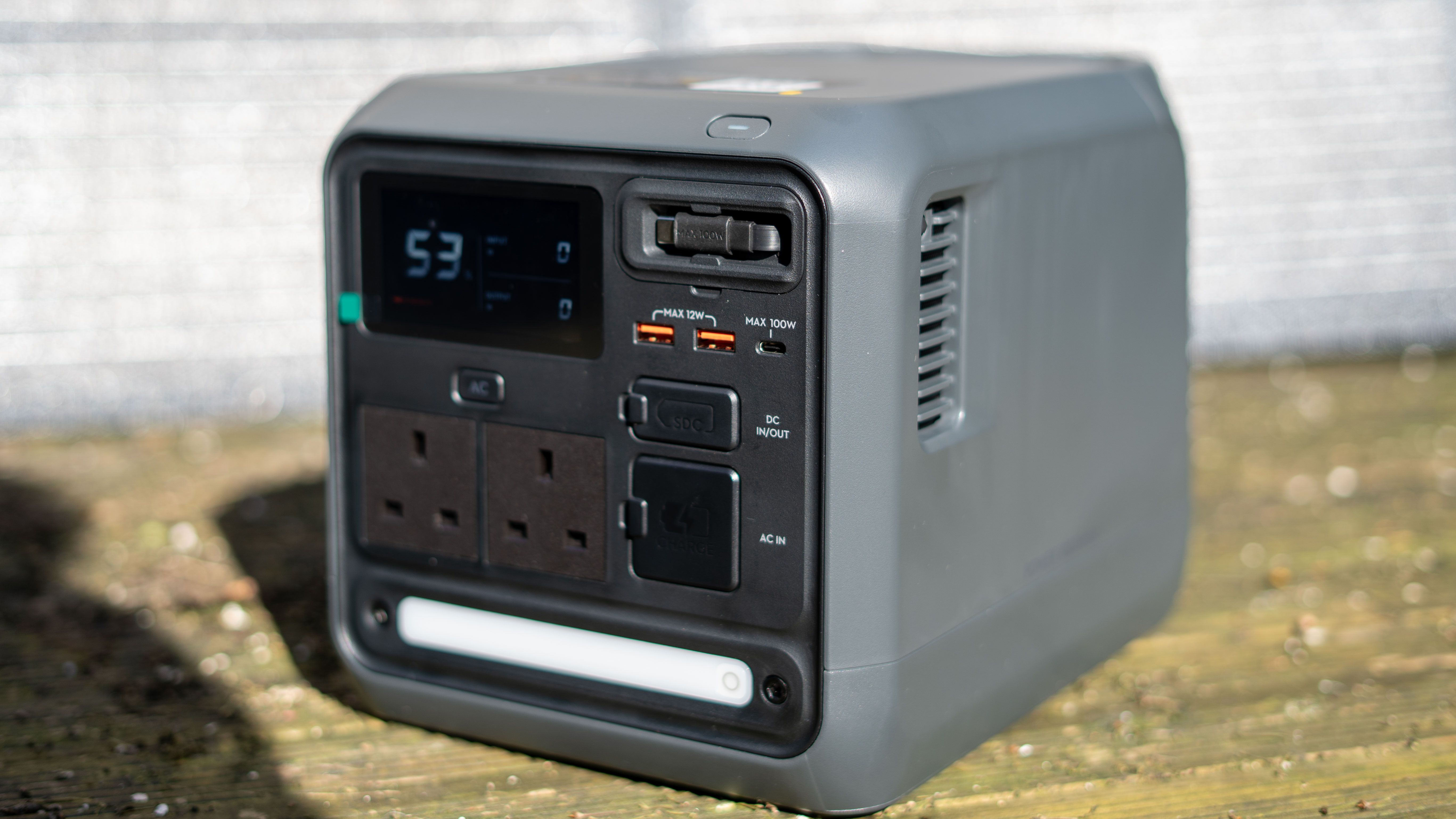 DJI Power 1000 Mini with solar panel behind