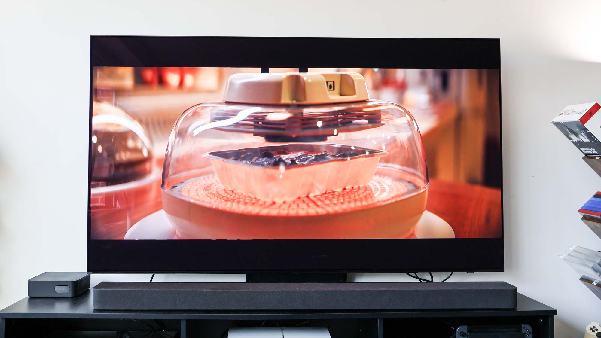 Samsung S90D OLED TV on table in living room