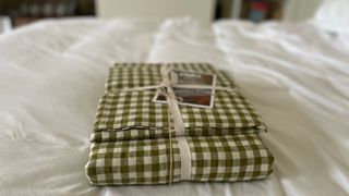 The packaging for Piglet In Bed Gingham Bedding