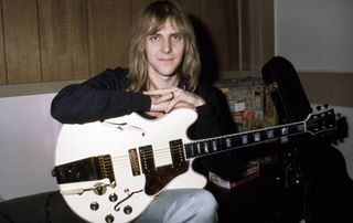 Alex Lifeson holds his beloved Gibson ES-355TD guitar
