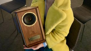 Tannoy Autograph Mini-OW held in Becky Scarrott's lap, at High End Munich