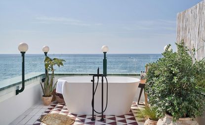 outdoor terrace with bath at Little Beach House Barcelona Spain