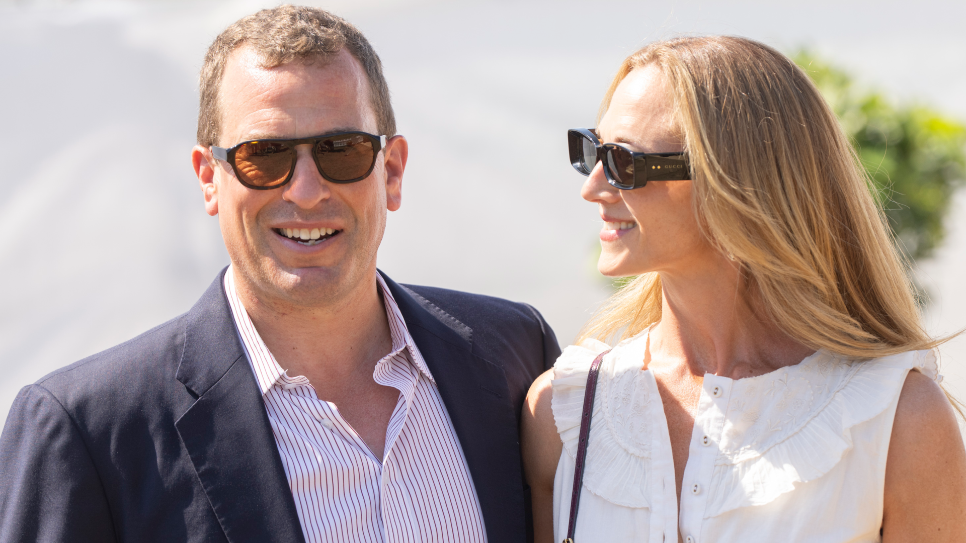 Peter Phillips and Harriet Sperling wearing sunglasses and smiling 