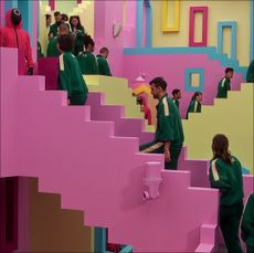 players walk up a staircase in squid game the challenge netflix
