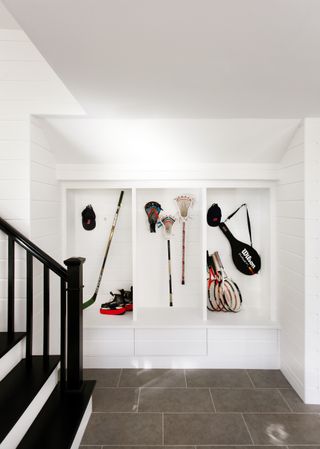 mudroom ideas with white walls and shallow recesses for storage