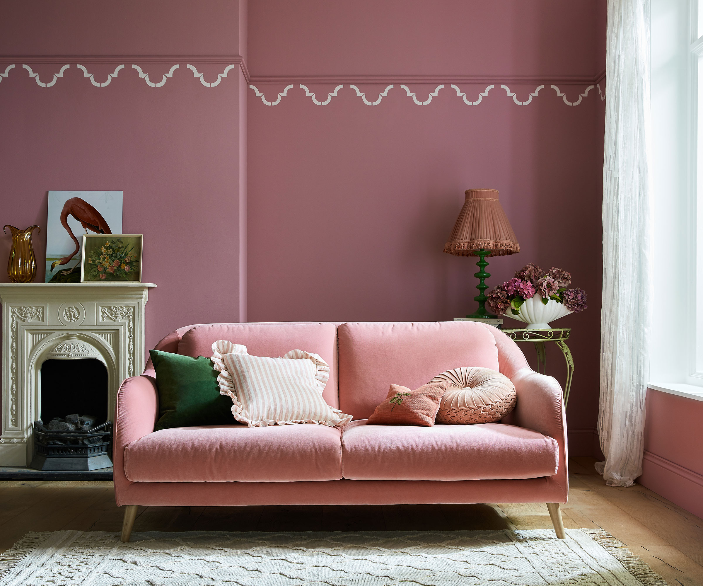 dusky pink living room with pink sofa
